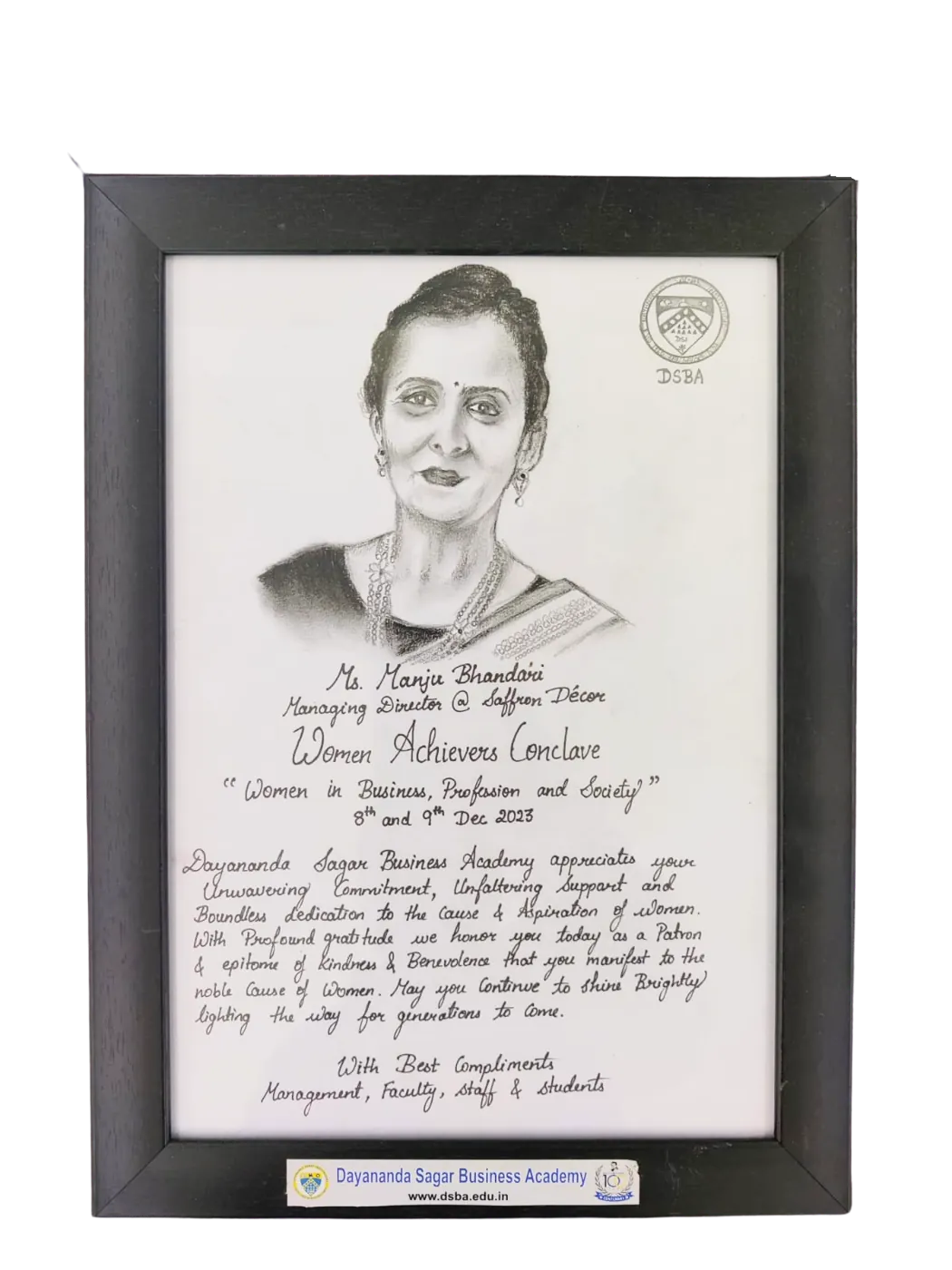 Framed portrait honouring Ms. Manju Bhandari at the Women Achievers Conclave, Dayananda Sagar Business Academy